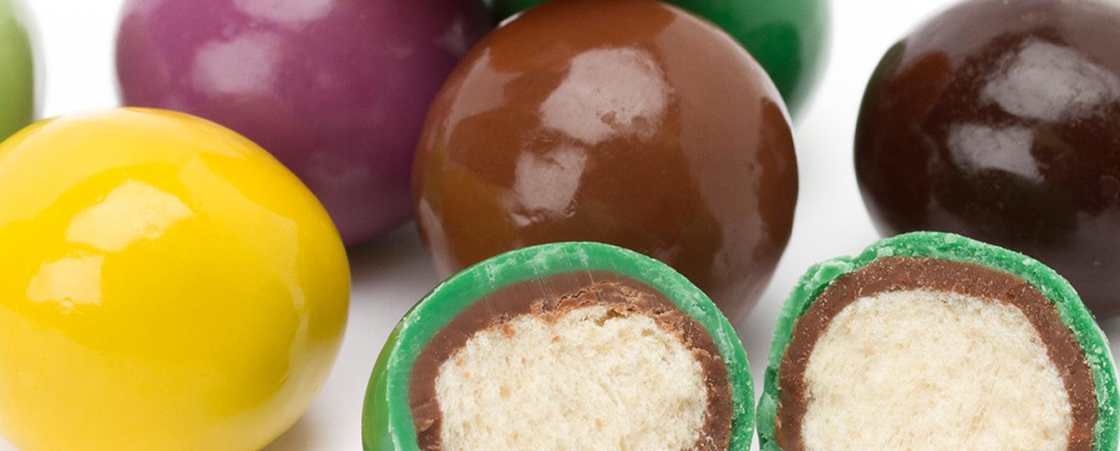 The Colorful History of Malted Milk Balls - Candy Warehouse